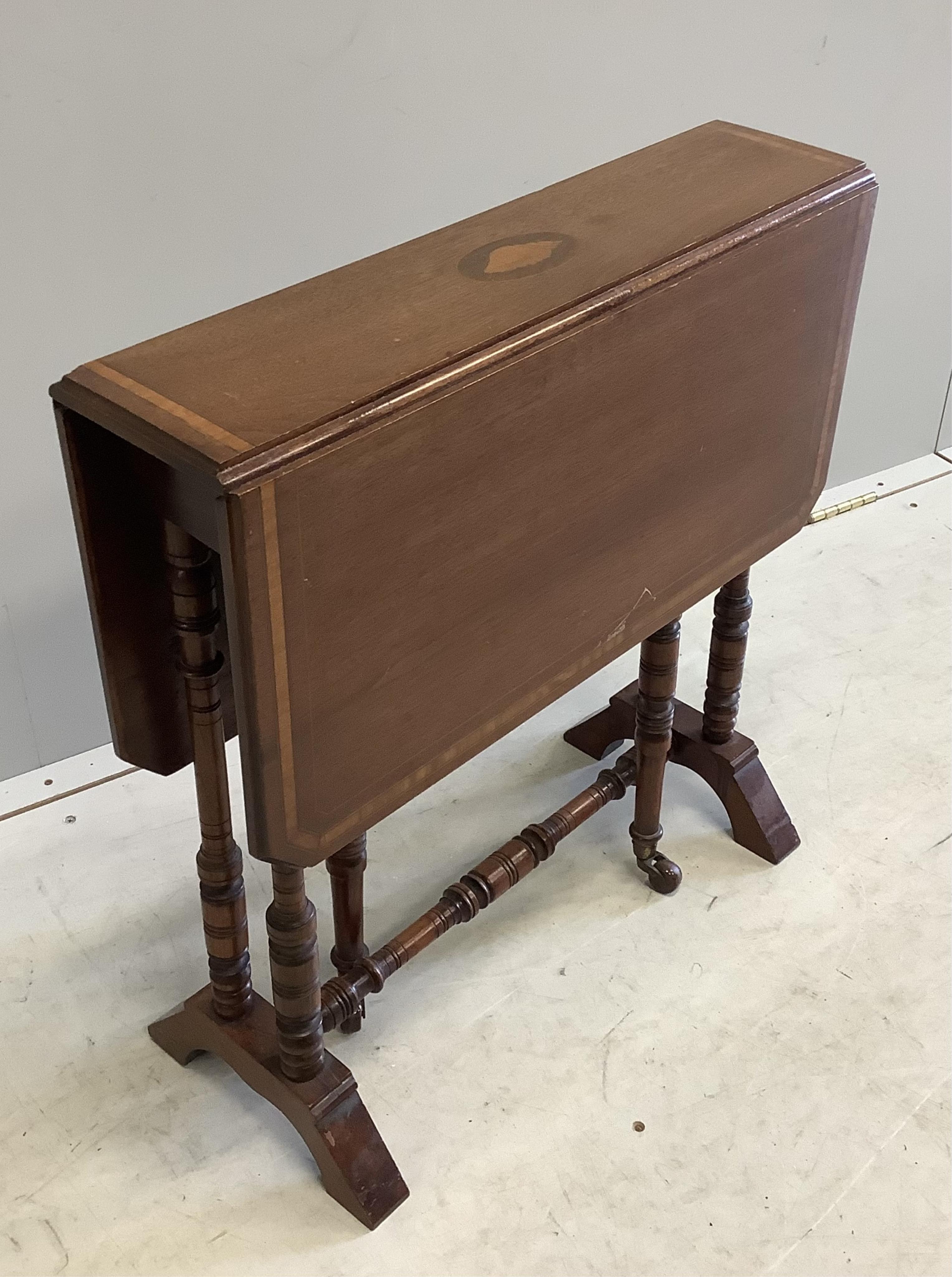 A late Victorian satinwood banded mahogany Sutherland table, width 61cm, depth 16cm, height 63cm. Condition - fair